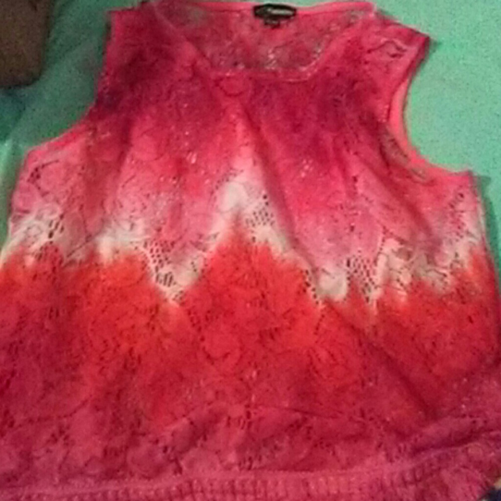 A kids see through top and a pink tank top